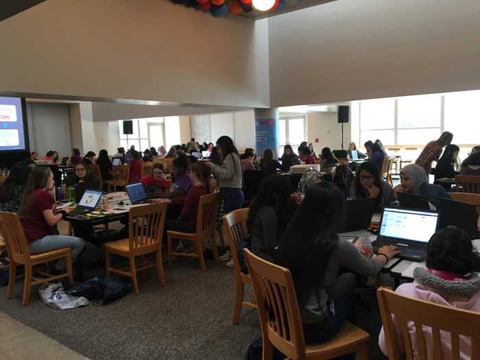 100 some young women/girls hacking away